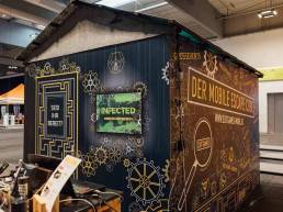 Exit Games Cube Infected Außenbeklebung auf Messe